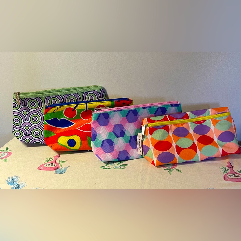 Four Clinique cosmetics bags. NWOT
